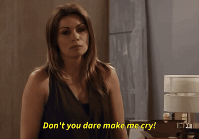 A Woman Says " Don T You Dare Make Me Cry " In Yellow Letters GIF