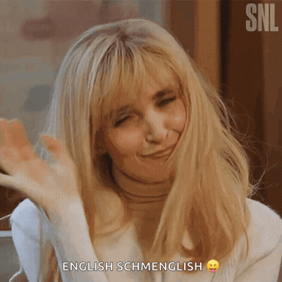 A Woman Says English Schmenglish With A Smiley Face On Her Face GIF