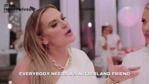 A Woman Says Everybody Needs A Switzerland Friend In Front Of A Pink Background GIF