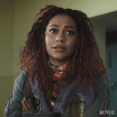 A Woman Says Everyone Has Skeletons In Front Of A Netflix Logo GIF