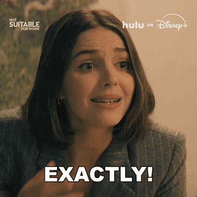 A Woman Says Exactly In Front Of A Sign That Says Now Suitable For Work GIF