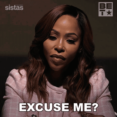 A Woman Says Excuse Me While Wearing A Pink Coat GIF