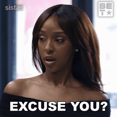 A Woman Says Excuse You In Front Of A Be I Logo GIF