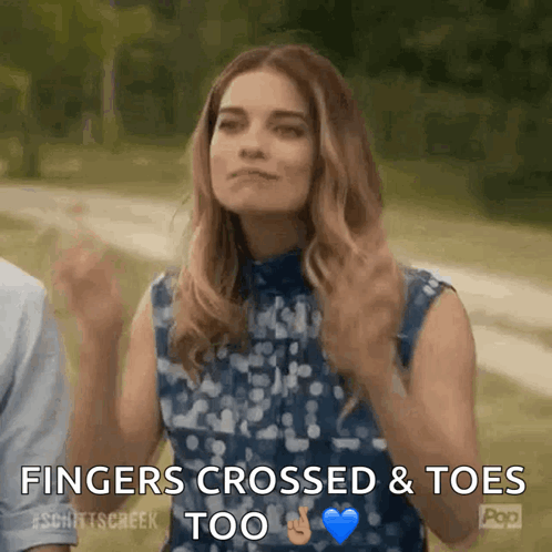 A Woman Says Fingers Crossed And Toes Too In A Gif