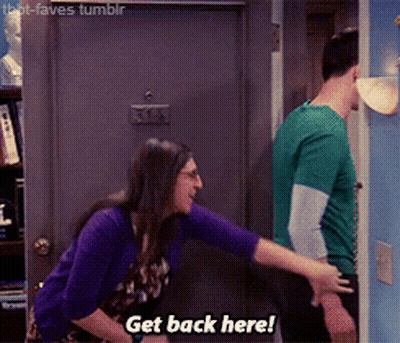 A Woman Says Get Back Here While A Man In A Green Shirt Stands Behind Her GIF