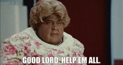 A Woman Says Good Lord Help Em All In A Floral Dress GIF