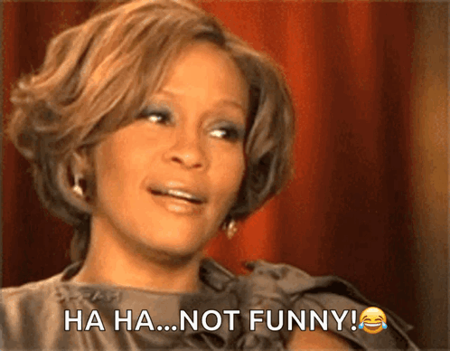 A Woman Says Ha Ha ... Not Funny While Laughing GIF