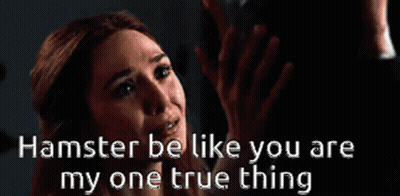 A Woman Says Hamster Be Like You Are My One True Thing In A Dark Room GIF