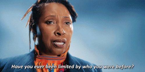 A Woman Says " Have You Ever Been Limited By Who You Were Before " In Front Of A Blue Background GIF