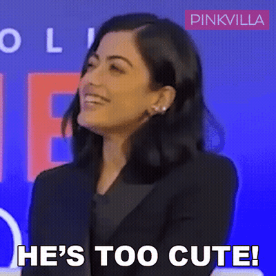 A Woman Says He 'S Too Cute In Front Of A Blue Background GIF