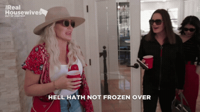 A Woman Says Hell Hath Not Frozen Over While Holding Two Red Cups GIF
