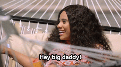 A Woman Says Hey Big Daddy In Front Of A Hammock GIF