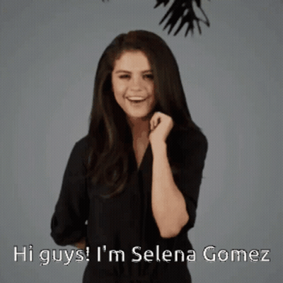 A Woman Says Hi Guys I 'M Selena Gomez In A Black Shirt GIF