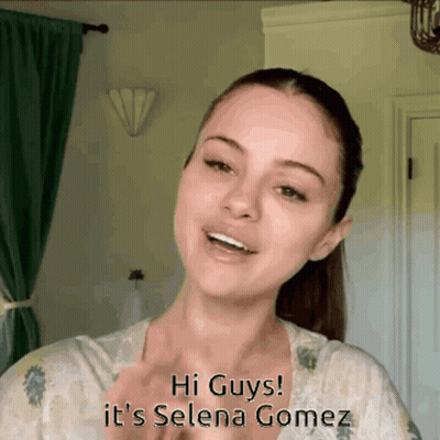 A Woman Says Hi Guys It 'S Selena Gomez In A Room GIF