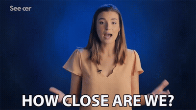 A Woman Says How Close Are We With Her Hands Outstretched GIF