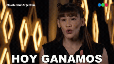 A Woman Says " Hoy Ganamos " In Front Of A Wall Of Lights GIF
