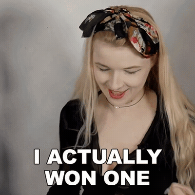 A Woman Says I Actually Won One In A Black Shirt GIF