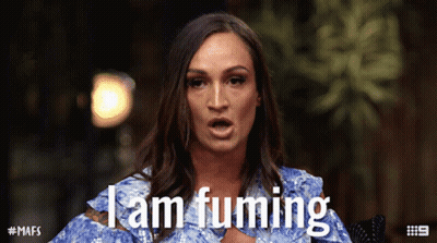 A Woman Says I Am Fuming In A Blue Dress GIF