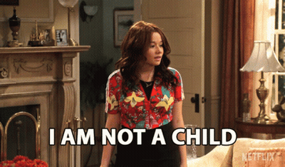 A Woman Says I Am Not A Child While Standing In A Living Room GIF