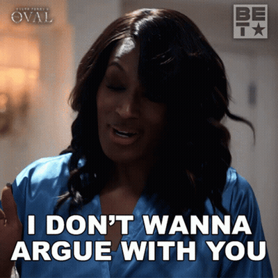 A Woman Says " I Don 'T Wanna Argue With You " While Wearing A Blue Robe GIF