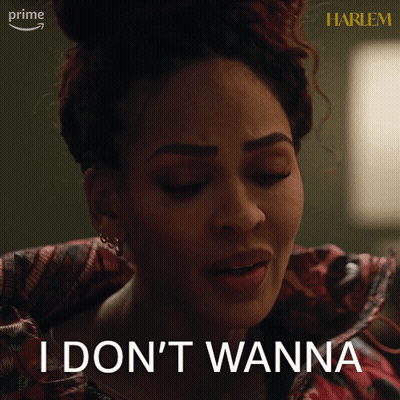 A Woman Says " I Don 'T Wanna " In Front Of A Harlem Sign GIF