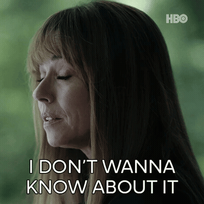 A Woman Says " I Don T Wanna Know About It " In Front Of A Green Background GIF