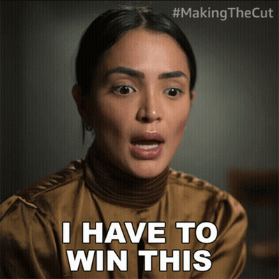 A Woman Says " I Have To Win This " While Wearing A Brown Shirt GIF