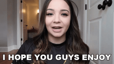 A Woman Says I Hope You Guys Enjoy In Front Of A Door GIF