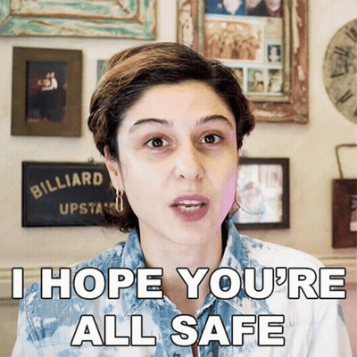 A Woman Says I Hope You 'Re All Safe In Front Of A Billiard Sign GIF
