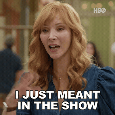 A Woman Says " I Just Meant In The Show " While Wearing A Denim Shirt GIF
