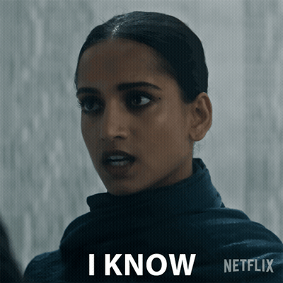 A Woman Says I Know In Front Of A Netflix Sign GIF