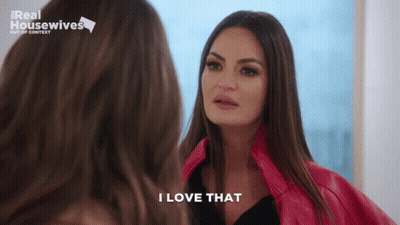 A Woman Says I Love That While Looking At Herself In The Mirror GIF