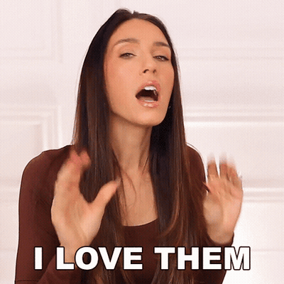 A Woman Says " I Love Them " With Her Mouth Open GIF