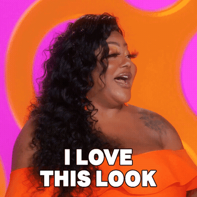 A Woman Says I Love This Look In Front Of A Pink And Orange Background GIF