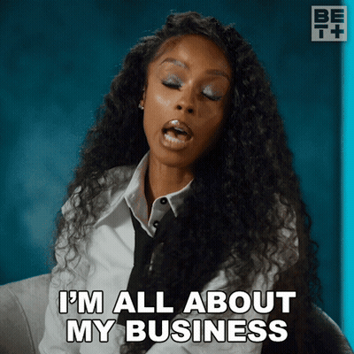 A Woman Says I 'M All About My Business While Wearing A White Shirt And Tie GIF