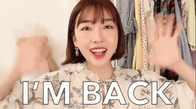 A Woman Says I 'M Back In Front Of A Closet Of Clothes GIF