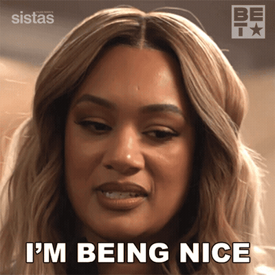A Woman Says " I 'M Being Nice " In Front Of A Sign That Says Sistas GIF