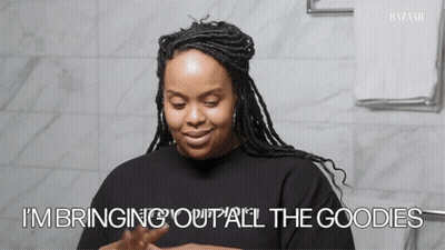 A Woman Says " I 'M Bringing Out All The Goodies " GIF