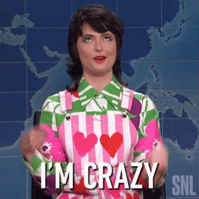 A Woman Says I 'M Crazy In Front Of A World Map GIF