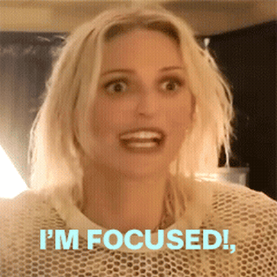 A Woman Says I 'M Focused While Making A Funny Face GIF
