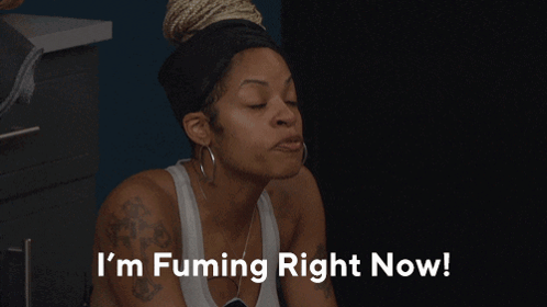 A Woman Says " I 'M Fuming Right Now " In Front Of A Black Background GIF