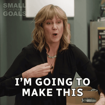 A Woman Says I 'M Going To Make This In Front Of A Small Achievable Goals Sign GIF