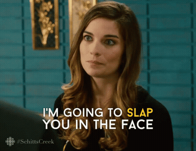 A Woman Says " I 'M Going To Slap You In The Face " In Yellow Letters GIF