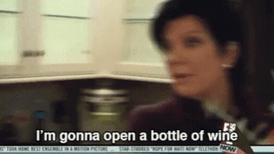 A Woman Says I 'M Gonna Open A Bottle Of Wine In A Kitchen GIF