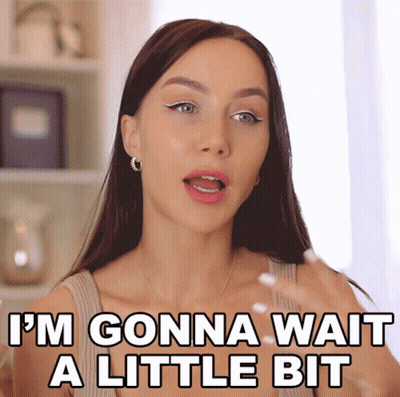 A Woman Says " I 'M Gonna Wait A Little Bit " In Front Of Her Face GIF