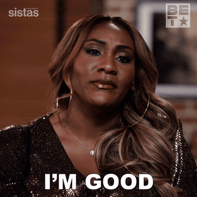 A Woman Says I 'M Good While Wearing A Gold Top GIF