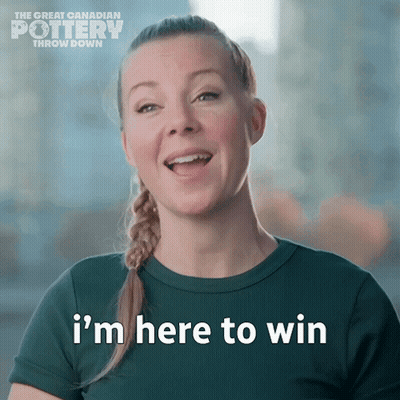 A Woman Says " I 'M Here To Win " In Front Of A Sign That Says The Great Canadian Pottery Throw Down GIF