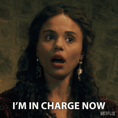 A Woman Says I 'M In Charge Now With A Netflix Logo Behind Her GIF