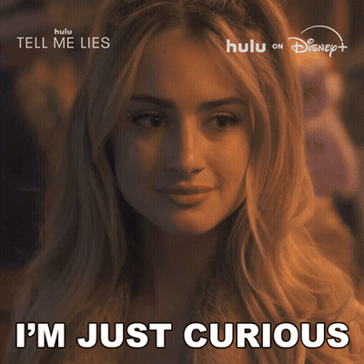 A Woman Says " I 'M Just Curious " In Front Of A Disney Poster GIF