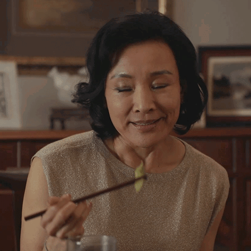A Woman Says I 'M Just Joking While Holding A Plate Of Food GIF